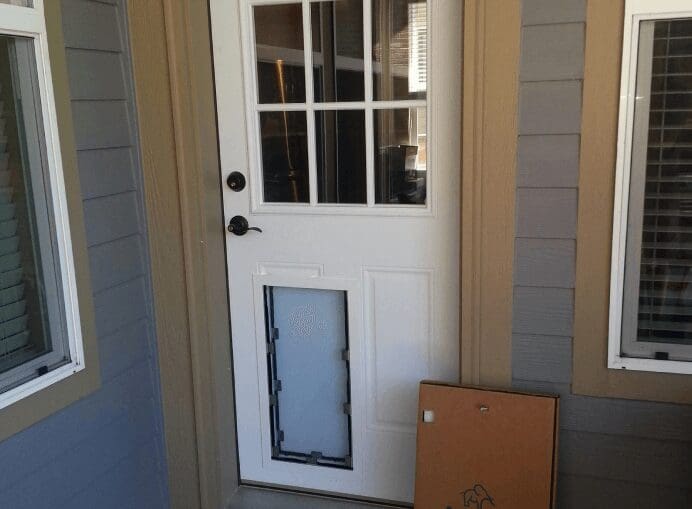 A door with a window and a box on the floor